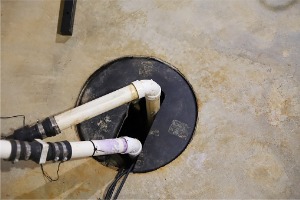 A sump pump installed by Basement Waterproofing Companies in Peoria IL