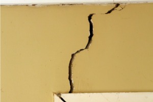 A cracked wall is seen. K-Mag, Foundation Contractors in Peoria IL, fix cracked walls.