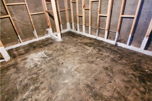 A basement is seen in the midst of repair, such as those performed by K-Mag, Basement Contractors in Peoria IL.