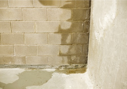 A basement wall with water coming in, in a home that needs Basement Systems in East Peoria IL