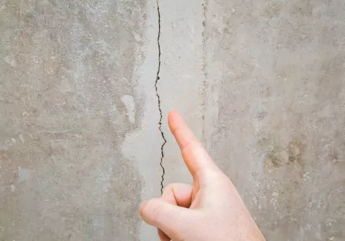 A crack in a basement wall, signaling the need for Foundation Repair in Metamora IL