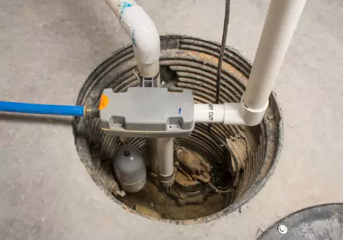 A sump pump used in basement waterproofing for Peoria IL