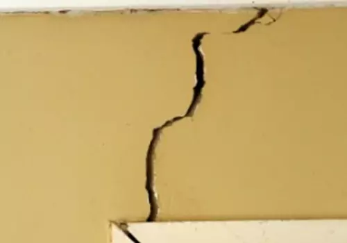 A cracked wall is seen. K-Mag, Foundation Contractors in Peoria IL, fix cracked walls.